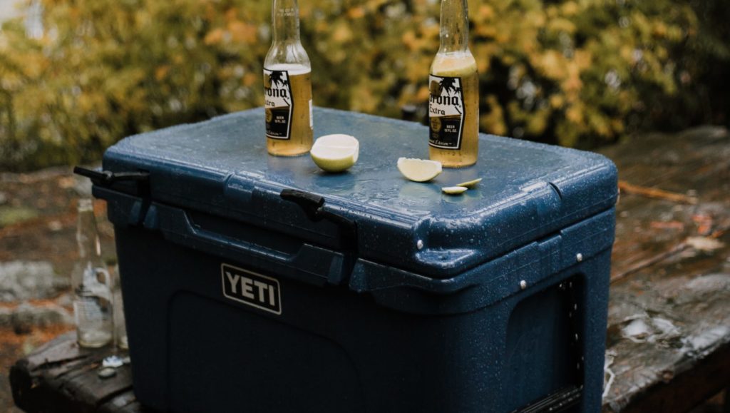 Blue Yeti Cooler with Beer on Top and Brisket Inside