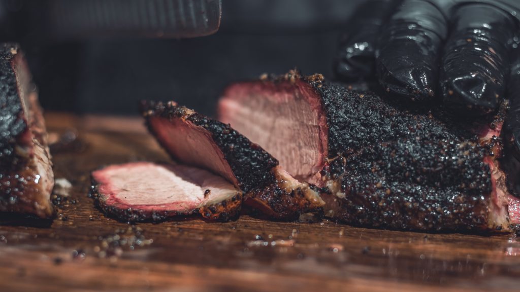 Well Cooked Brisket Being Cut for Serving