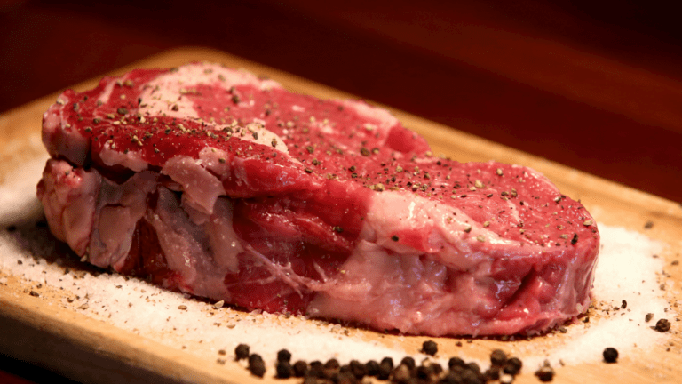 Beef Cut in the Table With Salt and Pepper
